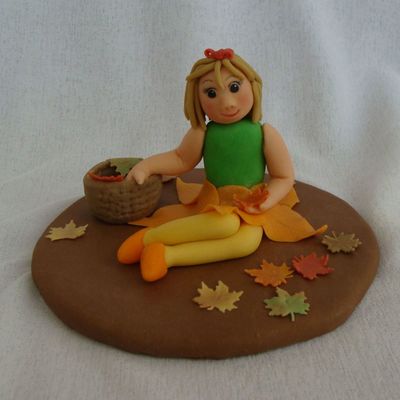 Little Girl Picking Leaves