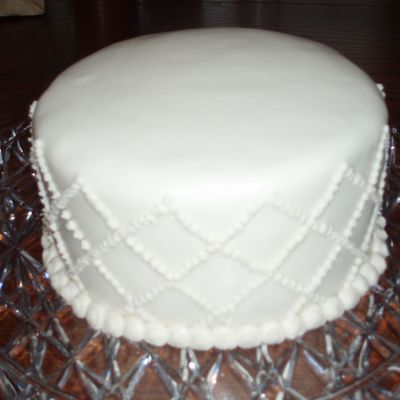 Round Cake With Quilted Sides Covered In Rolled Fondant