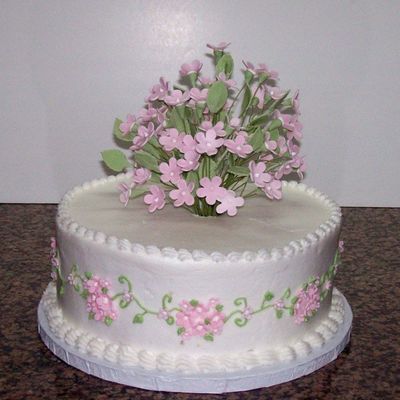 White Cake With Pink Bouquet