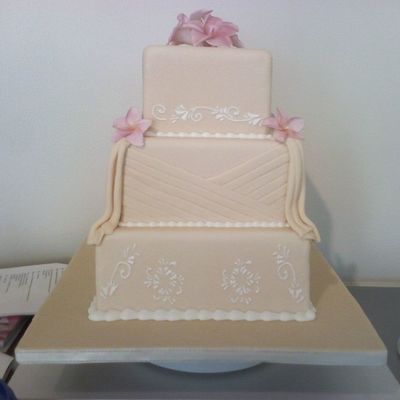 Plumeria And Drapes Wedding Cake