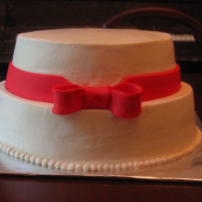 Oval Buttercream With Red Bow