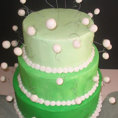 Green Cake With White Fondant Balls