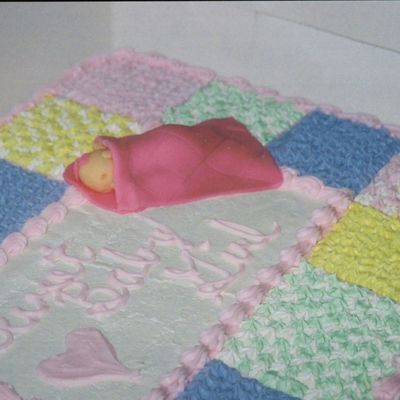 Fondant Baby On Quilt Cake