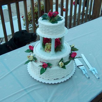 Round White Three Tier Wedding Cake