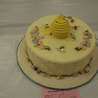 Bee Hive With Flower And Bees