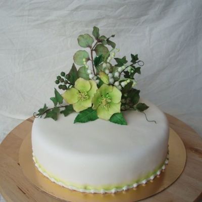 Green Cake With Hellebore, Lily Of The Valley, Ivy With Berries And Eucalyptus.