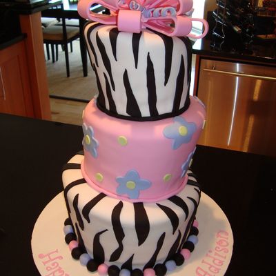 Zebra Stripe And Flowered Topsy Turvy Cake
