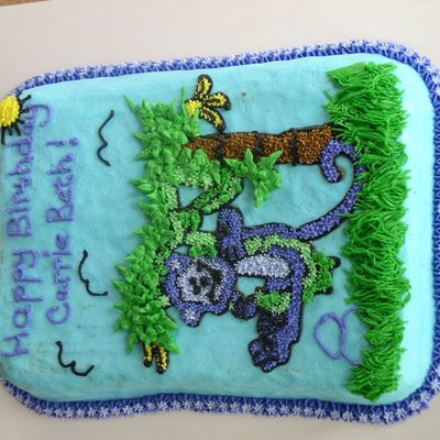 Monkey Swinging On A Vine