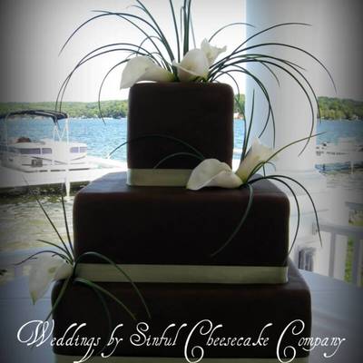 Brown Wedding Cake With Grasses And Calla Lilies