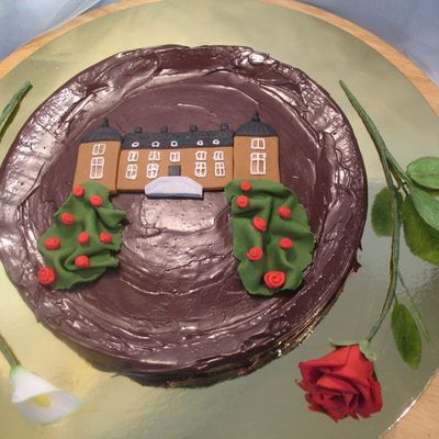 Chocolate Cake With A Castle And Flowers
