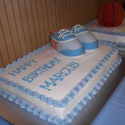 Sport Shoes On A Sheet Cake