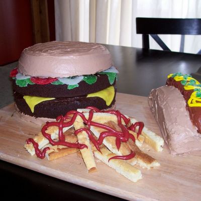 A Double Cheeseburger, A Hot Dog And A Side Of French Fries