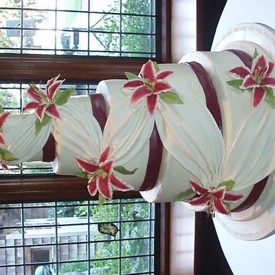 5 Tier Wedding Cake With Draping And Stargazer Lilies