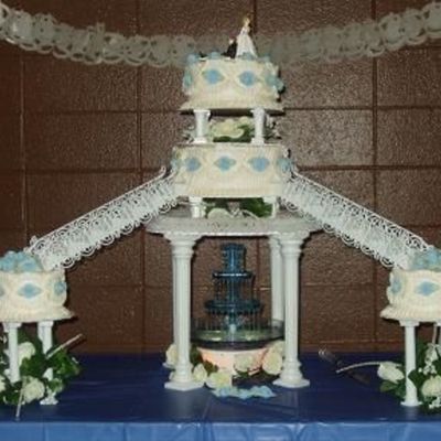 Three Tier Wedding Cake With Fountain And Stairs.