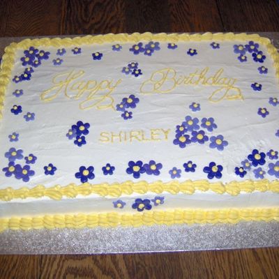 Yellow And Purple Cake With Fondant Flowers