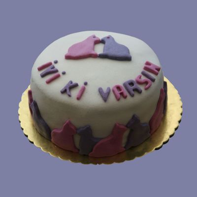A Cake With Pink And Purple Cats
