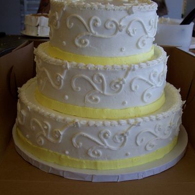 Wedding Cake With Scrolls And Buttercream Ribbon