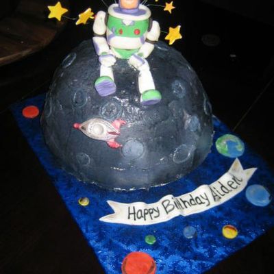 Buzz Lightyear Sitting On Top Of A Moon Rock.