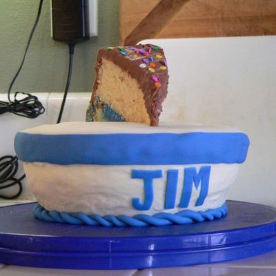 Slice Of Cake In A Bowl Of Milk