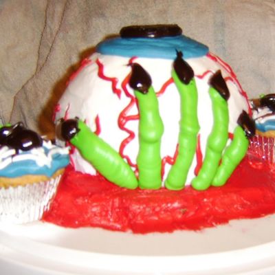 Creature Hand On The Back Of Eyeball Cake