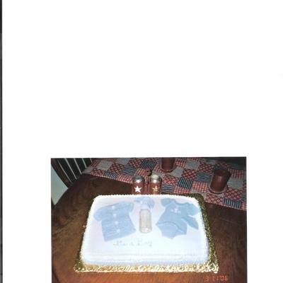 Baby Sweater And Onsie On Blanket