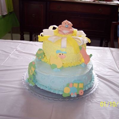 Baby In Middle Of Bow On Cake