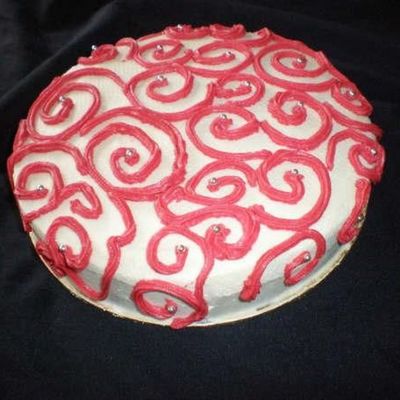 White & Red Scrollwork Cake