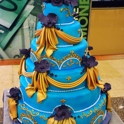 Blue Cake And Gold Drapings