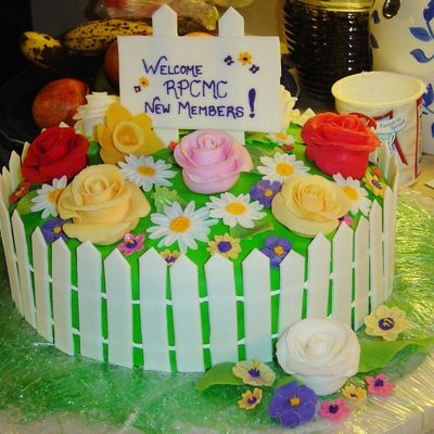 Spring Cake With Flowers And Picket Fence
