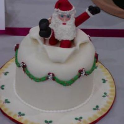 Santa Popping Out Of A Cake
