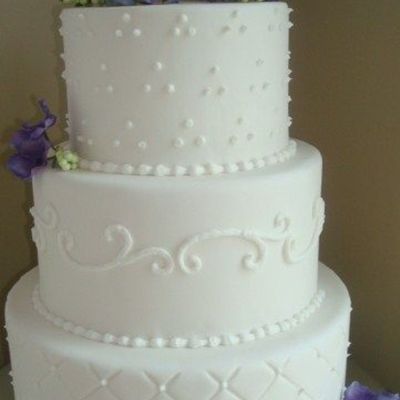 White Fondant Wedding Cake With Purple Hydrangeas