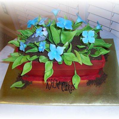 Flower Plants With Bird In Plant Container