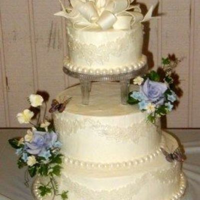 Buttercream With Gumpaste Flowers And Bow.