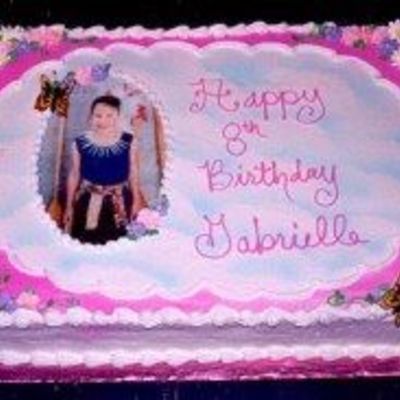 Buttercream With Royal Icing Flowers And Edible Image.