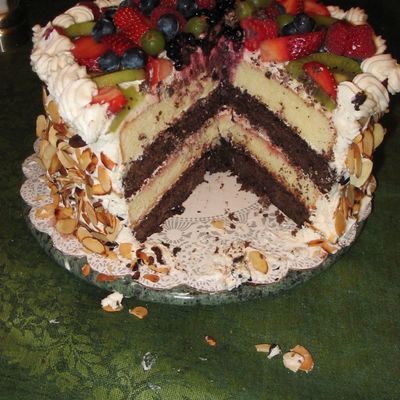 Fresh Fruit On Top Of Yellow And Chocolate Cake