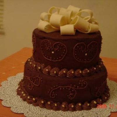 Chocolate Cake With Ganache Frosting , Filling And Scroll. Fondant Bows