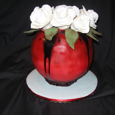Red Vase With Cake Bite Roses