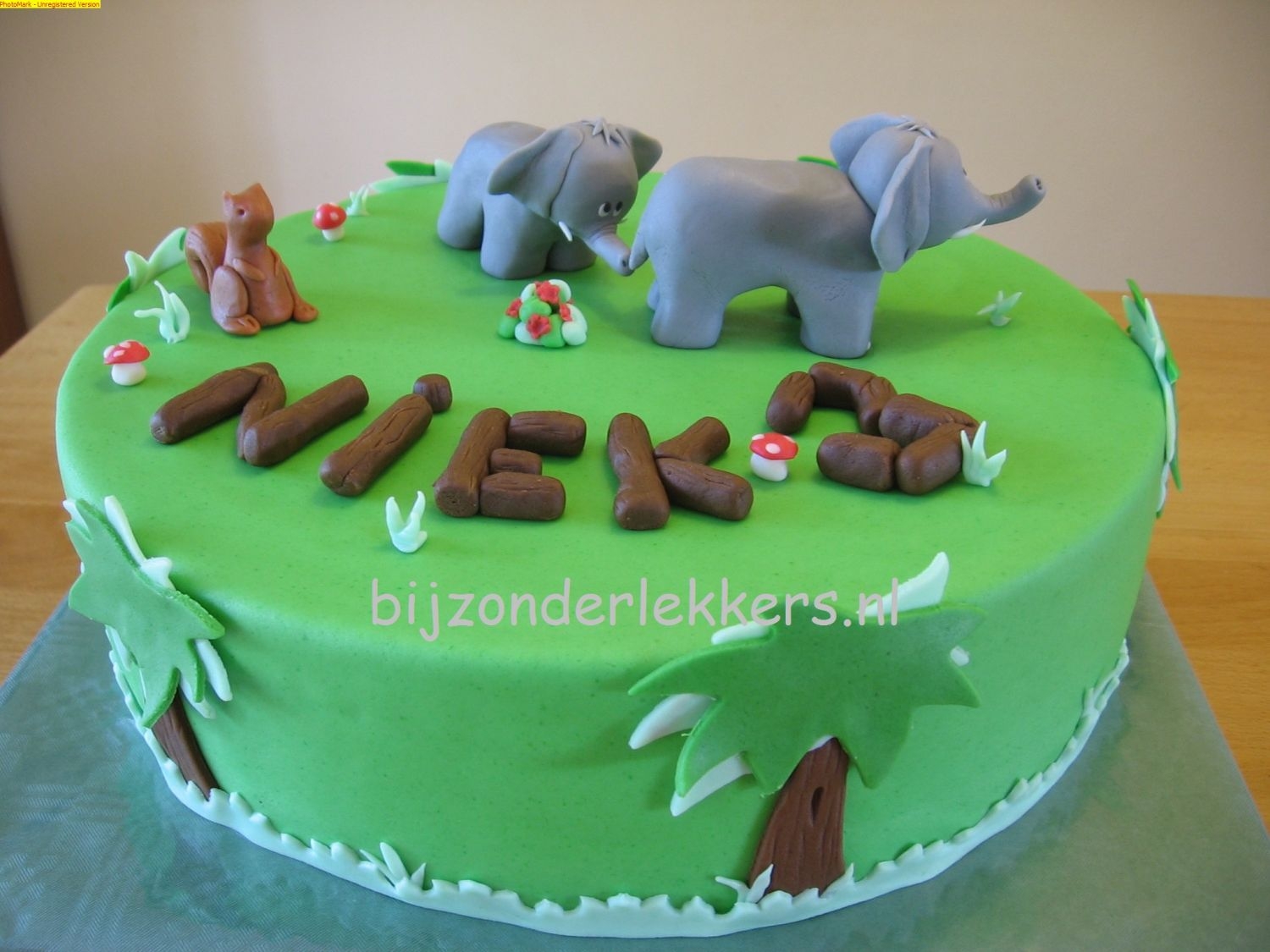 Elephant Mom And Kid In The Woods