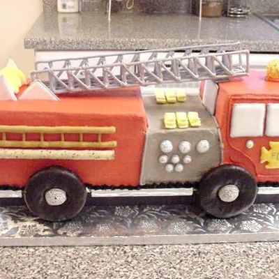 3D Fire Truck Cake Riding On Donut Wheels