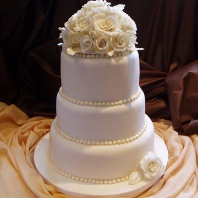 Stacked Ivory Cake With Handmade Cake Topper