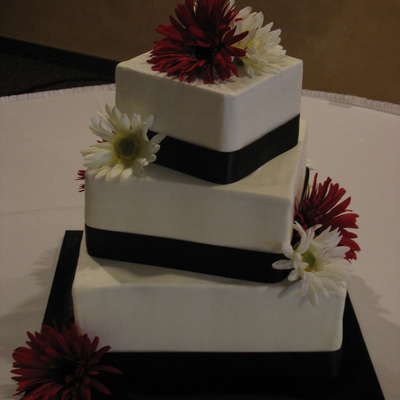 Square Tiers With Ribbons And Flowers