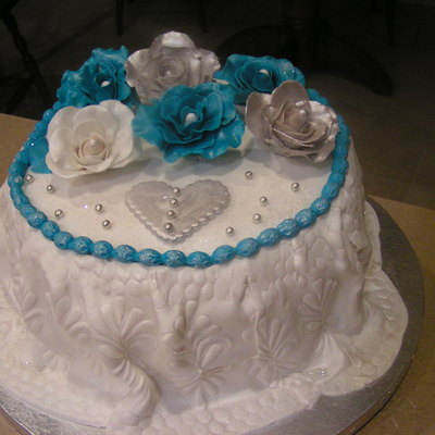 This Cake Is Part Of A Tiffany, Silver, And Beige Wedding Cake