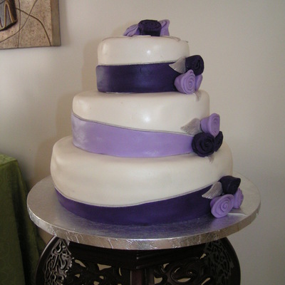 Lavender And Purple Wedding Cake With Ribbon Roses And Sliver Roses