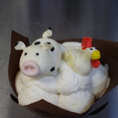Marzipan Cow And Chicken On Bananas Foster Cupcake