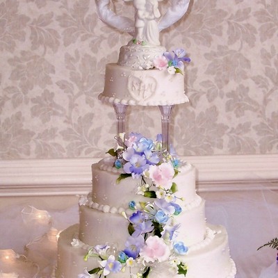 White Wedding Cake W/ Cascading Edible Flowers.