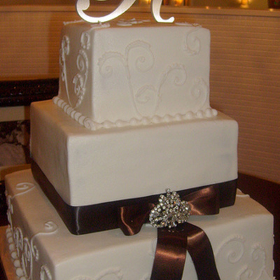 Off White Wedding Cake With Brown Ribbon