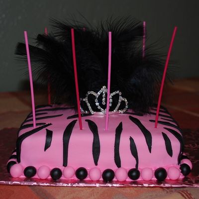 Pink And Zebra Print Cake With Tiera And Black Feathers