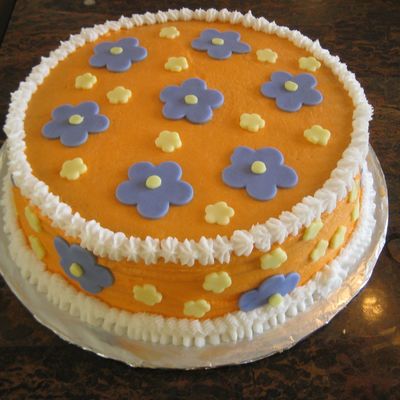 Orange Cake With Purple Flowers