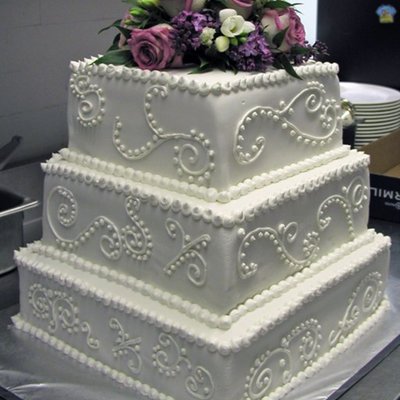 Scroll And Fresh Flowers Wedding Cake