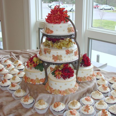 Fall Leaves Wedding Cake With Rounds And Cupcakes.